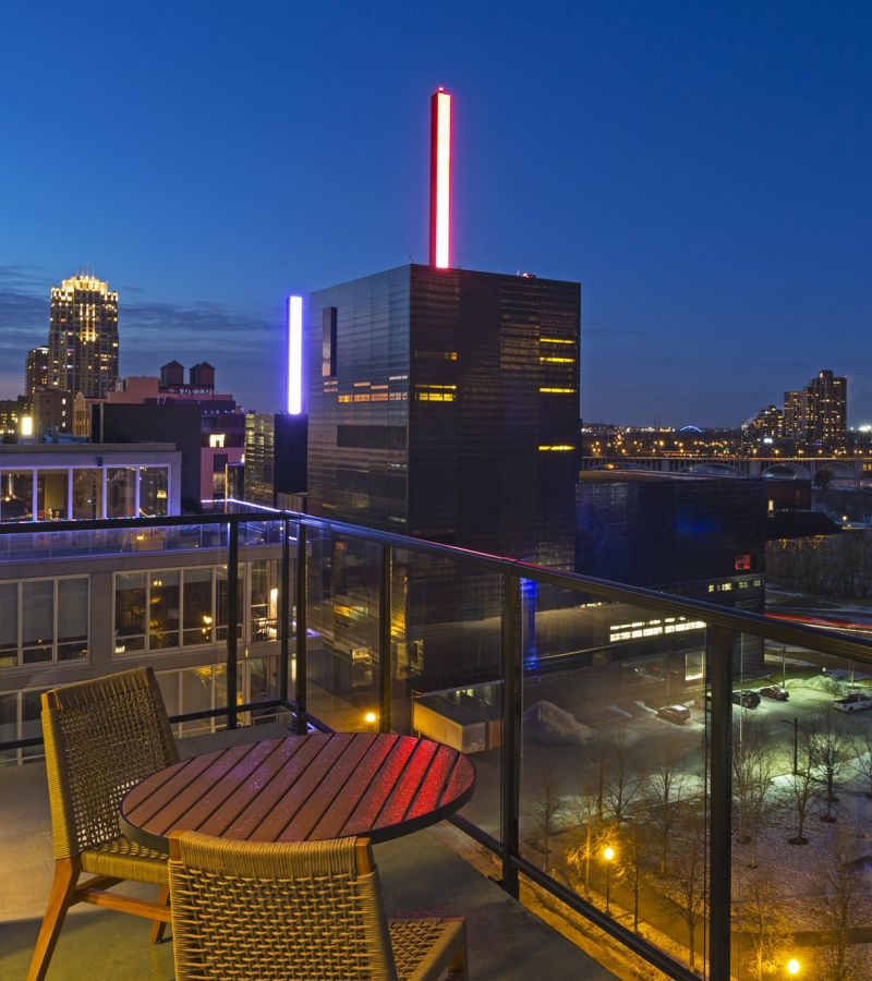 Encore apartments rooftop deck view at night of the city skyline